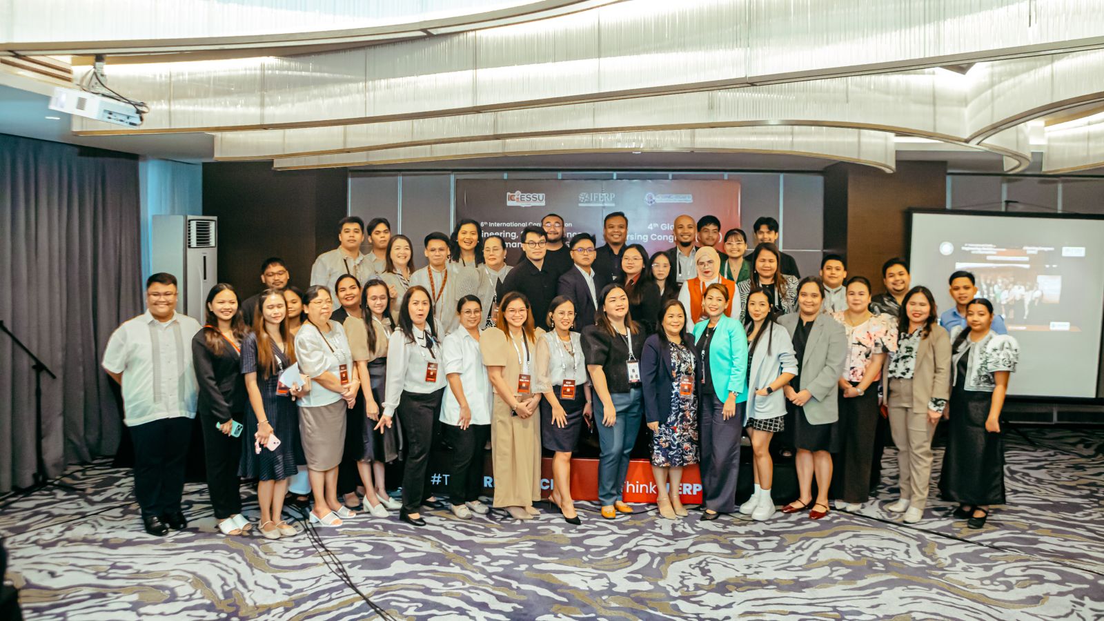 Delegates gathered on stage for the group photograph at the 6th ICESSU